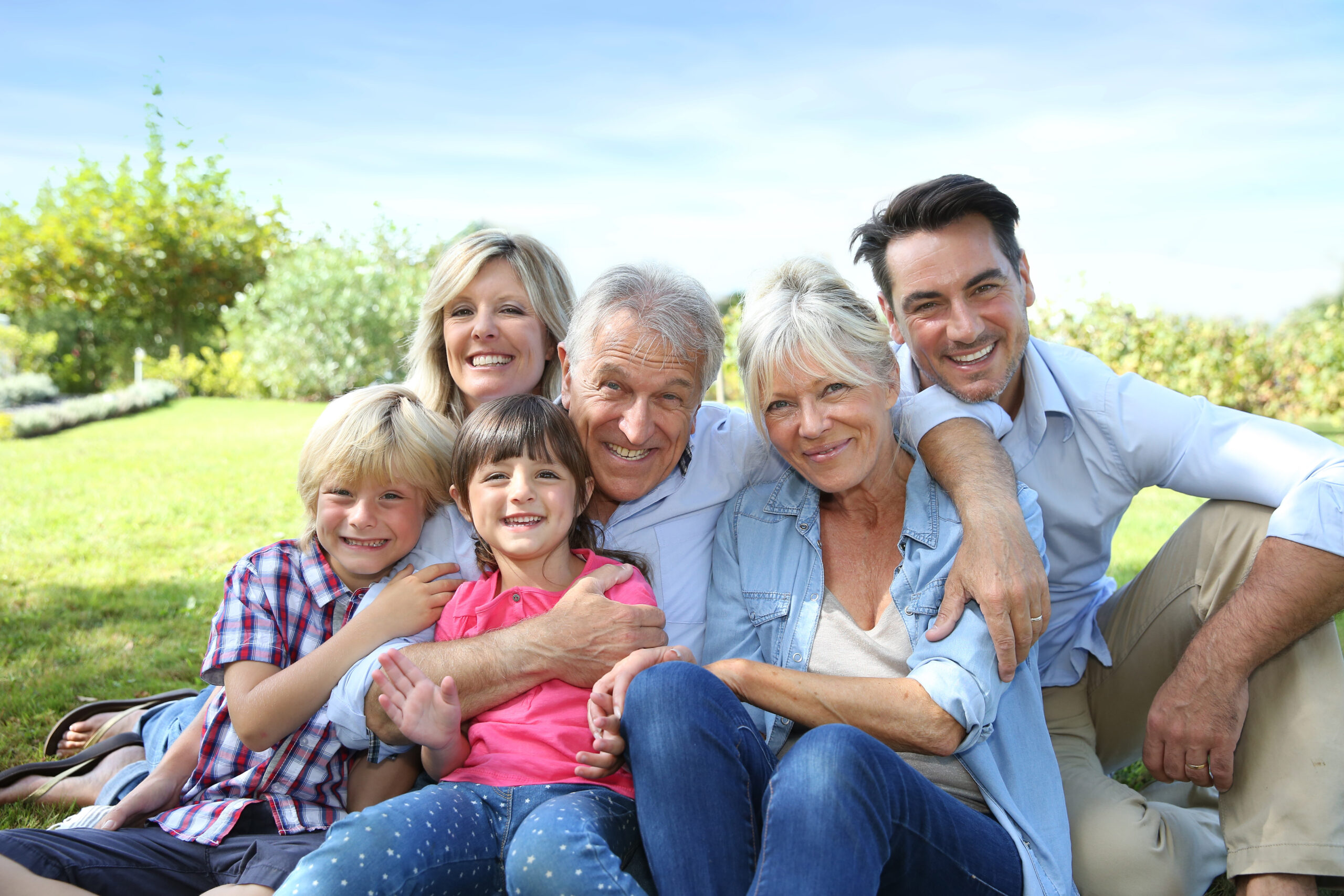 Happy 3 generation family in grandparents' backyard